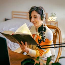 Woman reading and listening to an audiobook