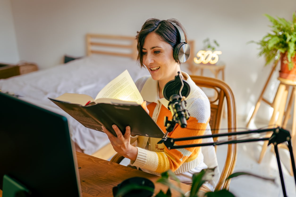 Woman reading and listening to an audiobook