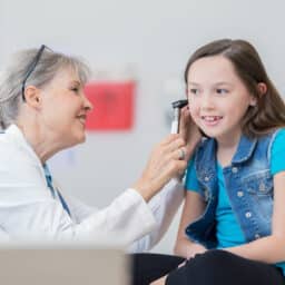 Young girl in an ear exam.