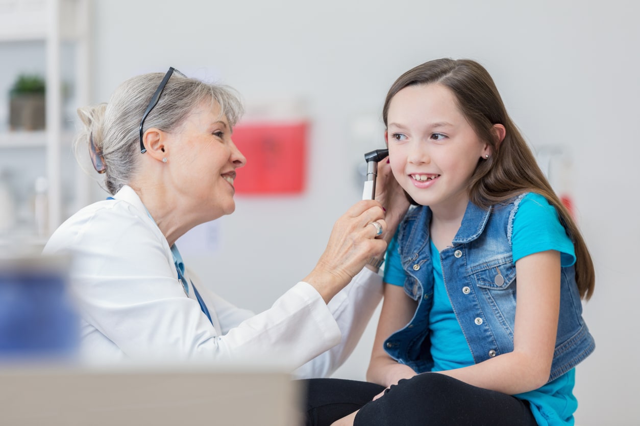 Young girl in an ear exam.